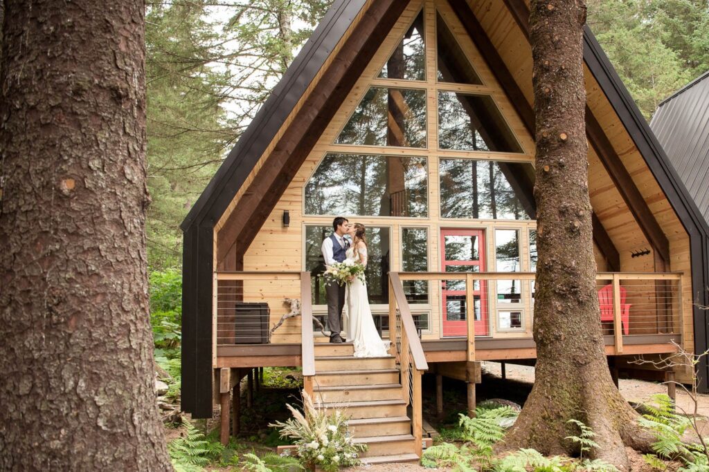 Boho elopement in Seward, Alaska at modern black A-frame cabins